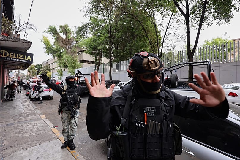 National Guards remove pedestrians by the General Prosecutor's headquarters in Mexico City, 22 February 2026