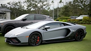 FILE - A Lamborghini sports car is displayed at the driving range during the final round of the LPGA Pelican Women's Championship tournament at Pelican Golf Club, 13 Nov 2025.