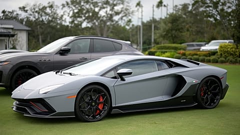 FILE - A Lamborghini sports car is displayed at the driving range during the final round of the LPGA Pelican Women's Championship tournament at Pelican Golf Club, 13 Nov 2025.