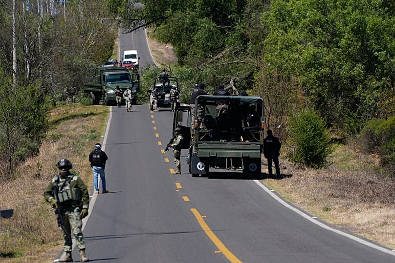 A soldier clears a roadblock on a road leading to Tapalpa, Mexico, Monday, Feb. 23, 2026, a day after the Mexican army killed Jalisco New Generation Cartel leader "El Mencho".