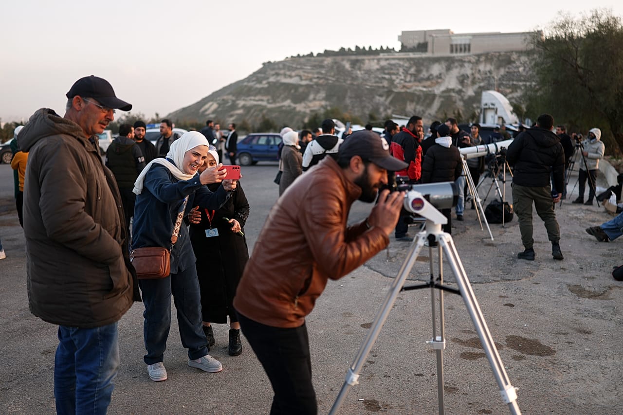 FILE: People gather to watch the Ramadan crescent moon marking the start of Ramadan at the foothills of Mount Qasioun, 17 Feb 2026