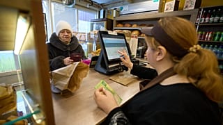 A customer buys bread at the Mashenka bakery outside Moscow, Russia, on Wednesday, Feb. 18, 2026. 
