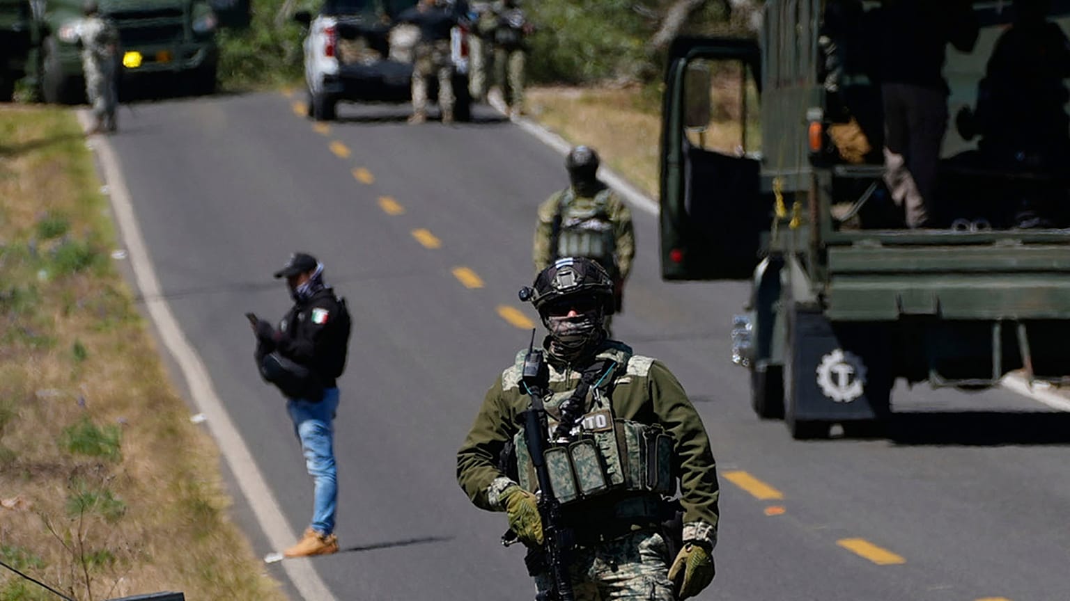 FILE: A soldier clears a roadblock on a road leading to Tapalpa, 23 February 2026