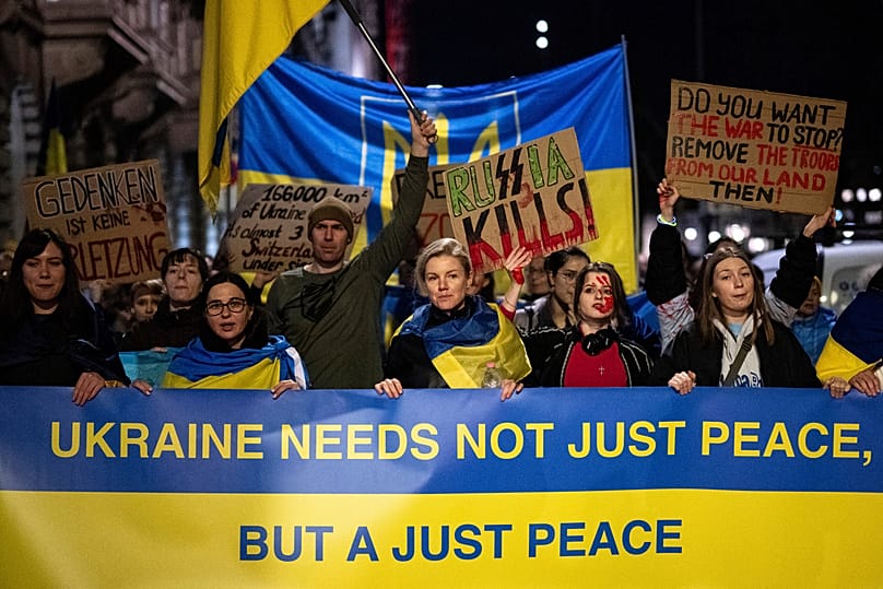 People take part in a protest against the Russian invasion of Ukraine on Tuesday, Feb. 24, 2026 to mark the fourth year anniversary of the Russian invasion, in Zurich.