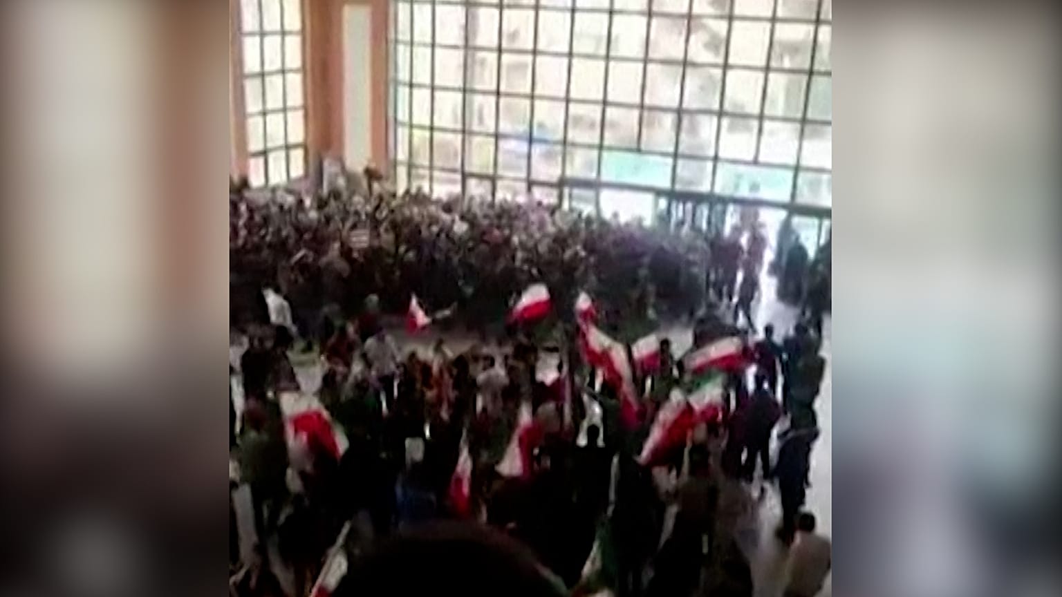 Students waving flags and chanting slogans at K. N. Toosi University of Technology