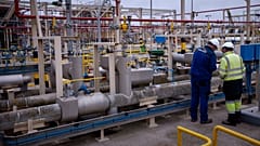 Operators work at Enagas regasification plant, the largest LNG plant in Europe, in Barcelona, Spain, March 29, 2022. 