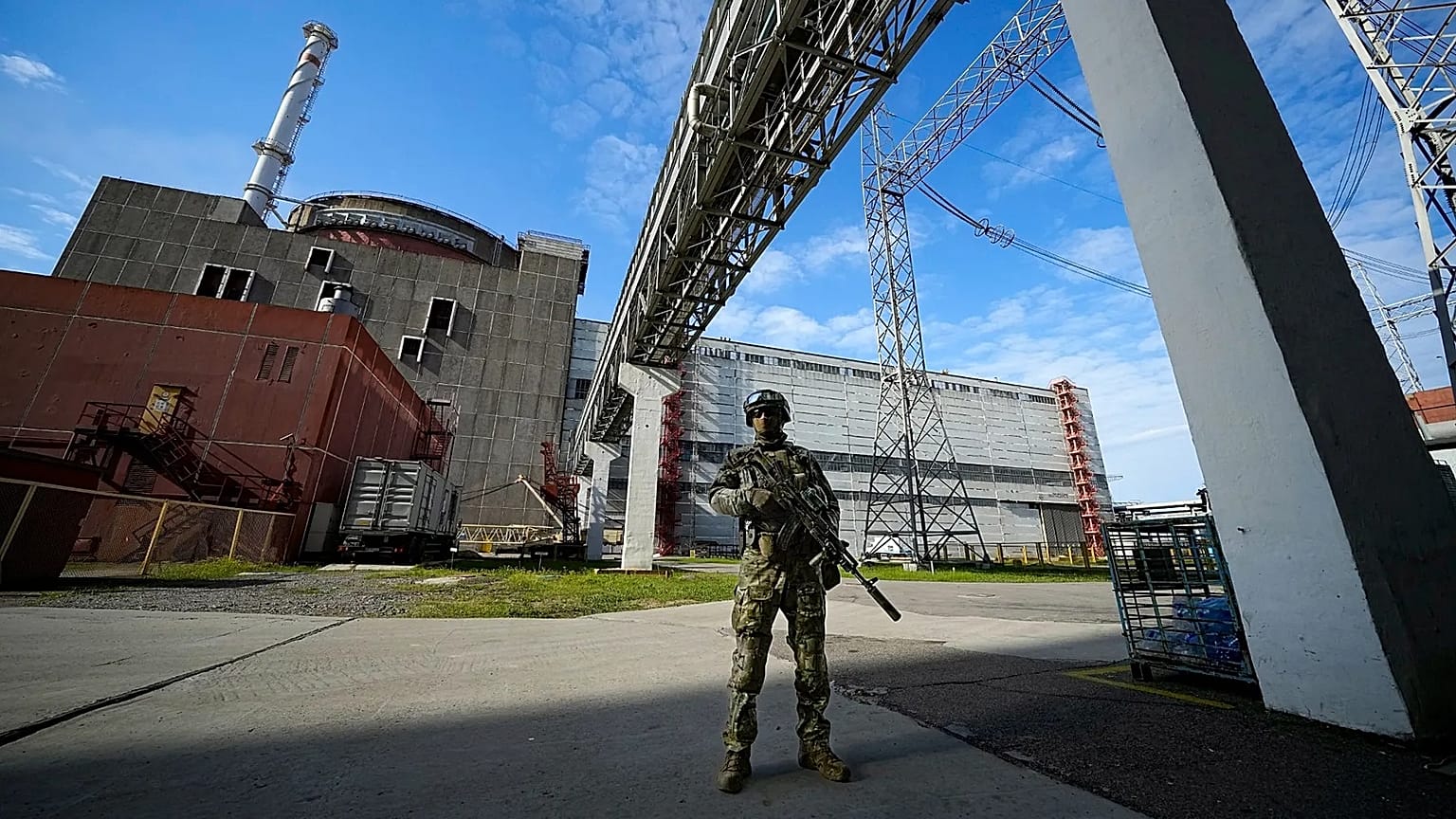 FILE - A Russian serviceman guards an area of the Zaporizhzhia Nuclear Power Station in territory under Russian military control, southeastern Ukraine, on May 1, 2022.