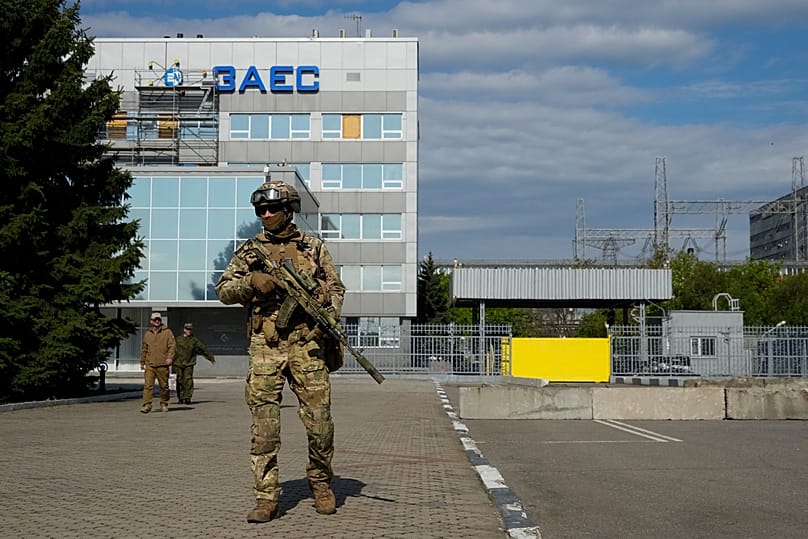 FILE - A Russian serviceman stands guard in an area of the Zaporizhzhia Nuclear Power Station in territory under Russian military control, southeastern Ukraine, on May 1, 2022