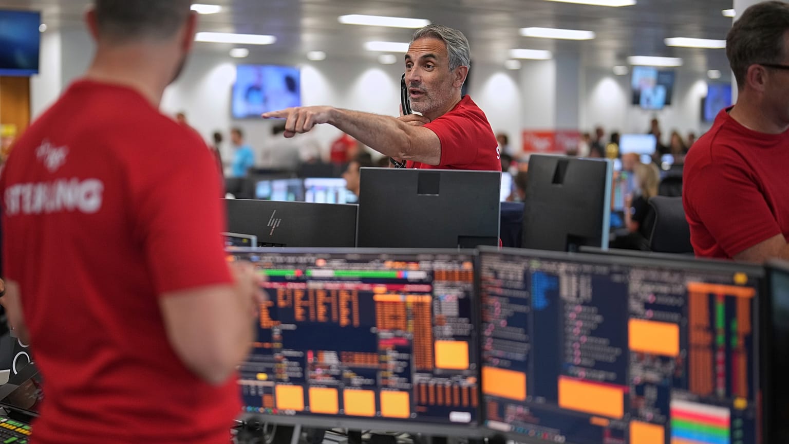 FILE. Brokers work on the trading floor at BGC Group, London, Sept. 2025