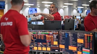 FILE. Brokers work on the trading floor at BGC Group, London, Sept. 2025