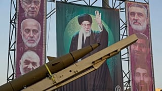 FILE: A domestically-built missile "Khaibar-buster," and banners showing portraits of the Iranian Supreme Leader Ayatollah Ali Khamenei, in Tehran, 25 September 2025