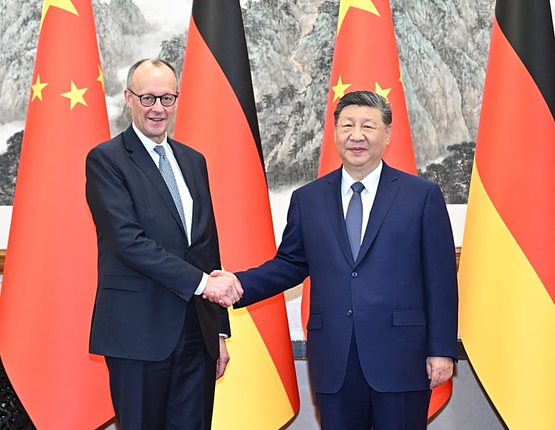 Friedrich Merz und Xi Jinping. 