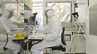An engineer at work in imec's cutting-edge semiconductor facility.