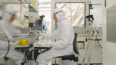 An engineer at work in imec's cutting-edge semiconductor facility.