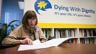 FILE: Linda Jarrett reads through notes at Dying with Dignity offices in Toronto, Friday, Feb. 6, 2015. 