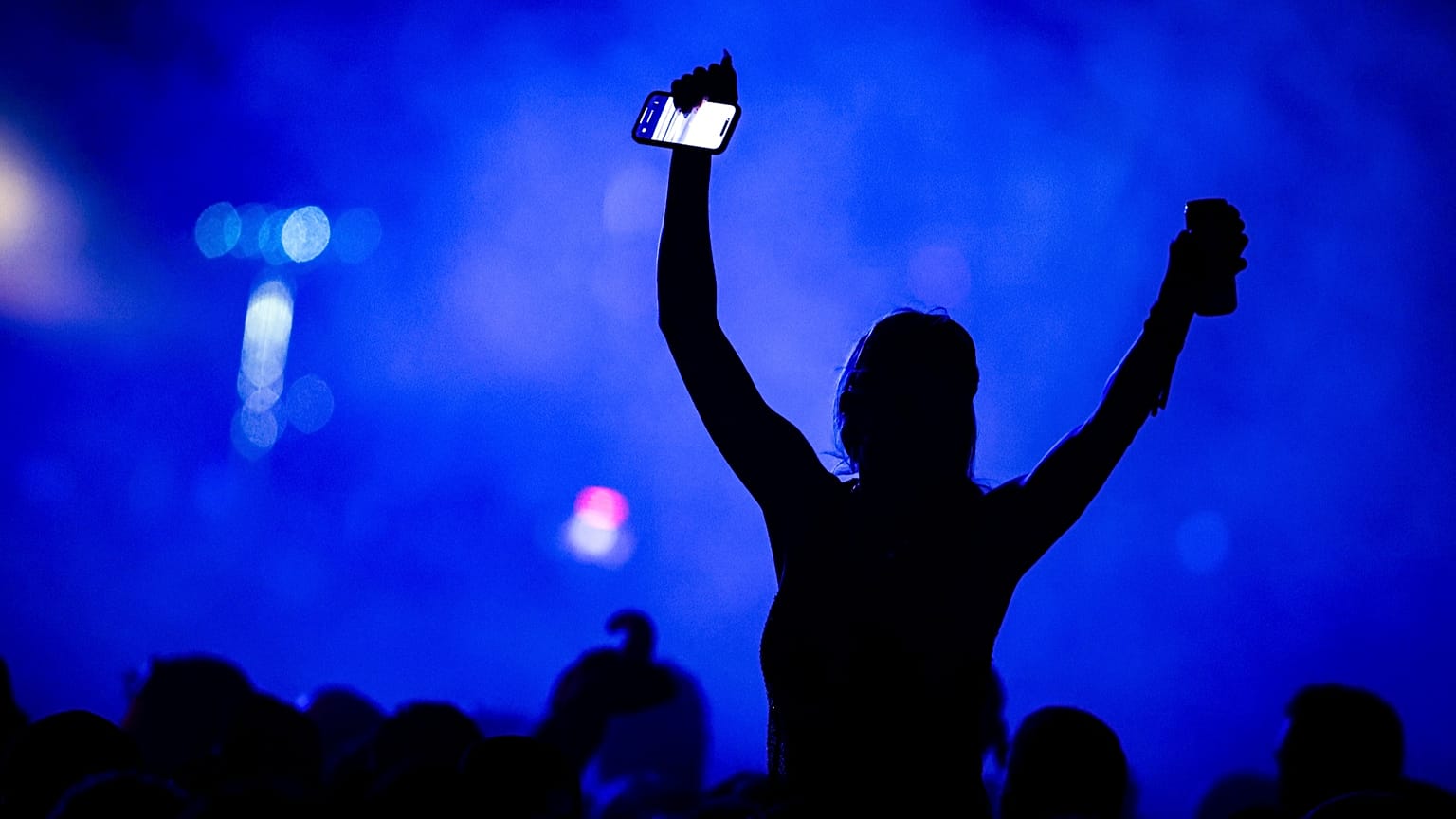 FILE: A person dances during a DJ's performance at Parookaville in Germany, July 19, 2025.
