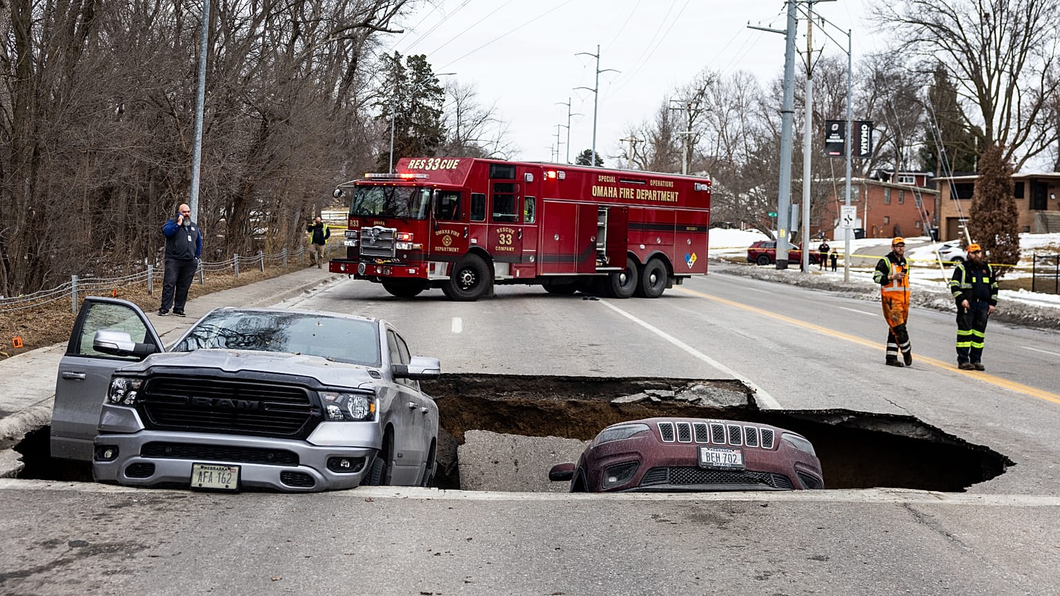 Two vehicles fell into a sinkhole on Pacific Street just east of 67th Street in Omaha on Tuesday, Feb. 24, 2026