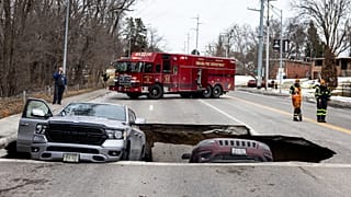 Two vehicles fell into a sinkhole on Pacific Street just east of 67th Street in Omaha on Tuesday, Feb. 24, 2026