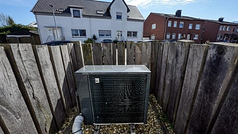 An air-to-water heat pump system is installed at a suburb new housing estate in Marl, Germany.