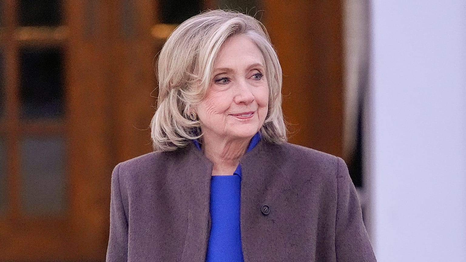 Former Secretary of State Hillary Clinton walks outside the Chappaqua Performing Arts Center, Thursday, Feb. 26, 2026.