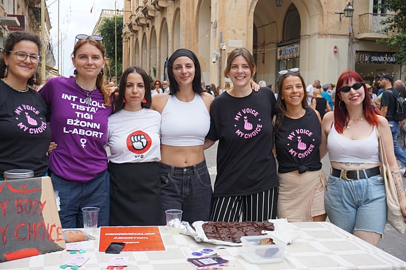 Women's rights activists, including Belle de Jong, pose for a photo at a pro-abortion rally in Valletta on International Safe Abortion Day, Dec. 28, 2025. Valletta, Malta.