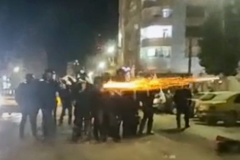 FILE - This image from a video verified by AP shows Iranian security forces shooting into the courtyard outside the Imam Khomeini Hospital, in Ilam, Iran, Jan. 4, 2026