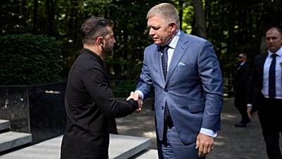  In this photo provided by the Ukrainian Presidential Press Office, Ukrainian President Volodymyr Zelenskyy, left, and Prime Minister of Slovakia Robert Fico shake hands in Uz