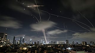 The Israeli Iron Dome air defense system intercepts missiles during an Iranian attack on Tel Aviv, Israel, June 18, 2025