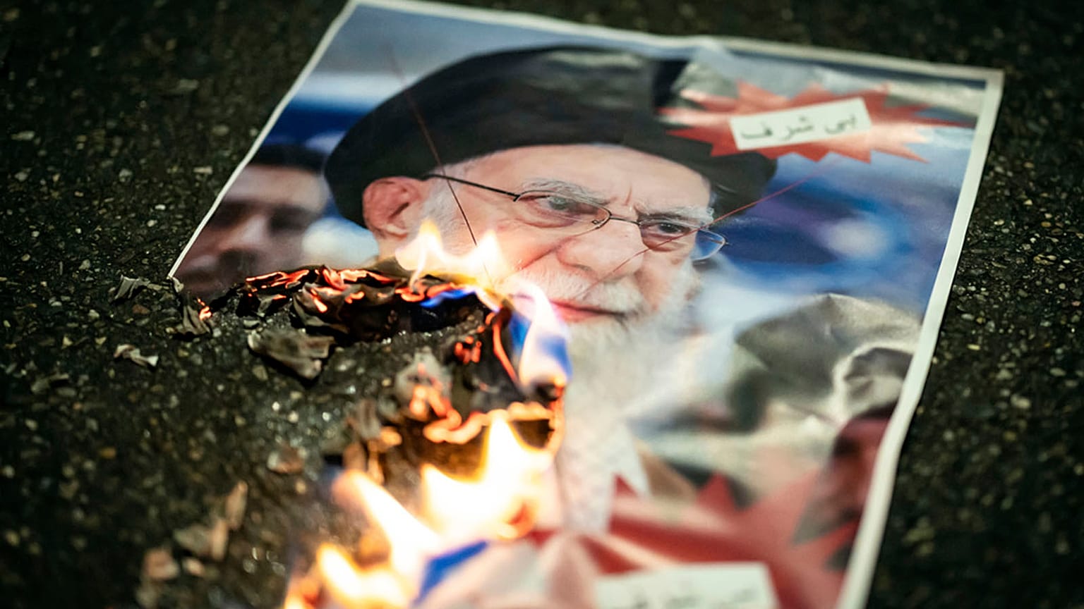 FILE: A burning image of the Ayatollah Ali Khamenei is seen during a rally in support of the nationwide mass demonstrations in Iran against the government, 13 January 2026