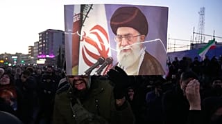Government supporters mourn in a gathering after state TV officially announced the death of Iranian Supreme Leader Ayatollah Ali Khamenei in Tehran, 1 March, 2026
