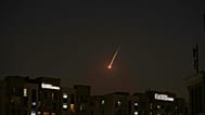The flare of a projectile is seen over the skyline of Dubai, UAE on Saturday 28 February