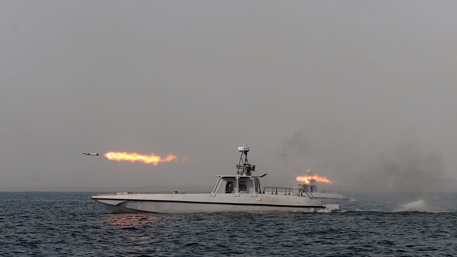 FILE. An Iranian navy boat fires a missile in a drill in the sea of Oman, on Dec. 2011.
