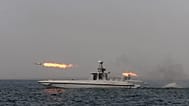 FILE. An Iranian navy boat fires a missile in a drill in the sea of Oman, on Dec. 2011.