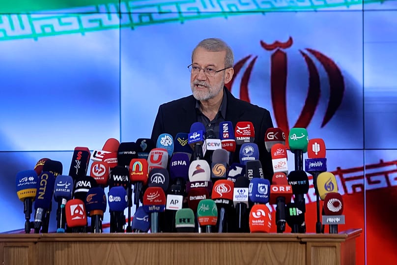FILE: Iran's former parliament speaker Ali Larijani speaks with media after registering his name as a candidate for the June 28 presidential elections, in Tehran, 31 May 2024