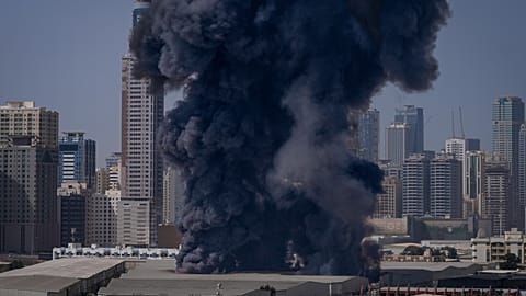 An Iranian air strike resulting in black plums of smoke in the UAE