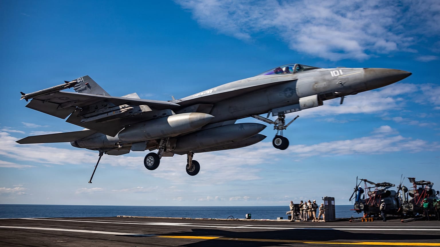 Aircraft attached Strike Fighter Squadron 37, lands on the flight deck of the world's largest aircraft carrier while operating in support of Operation Epic Fury, March 1, 20