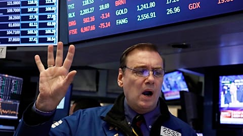 FILE. Specialist Patrick King works on the floor of the NYSE as stocks open sharply lower following big drops in Asia and Europe, Oct. 2018
