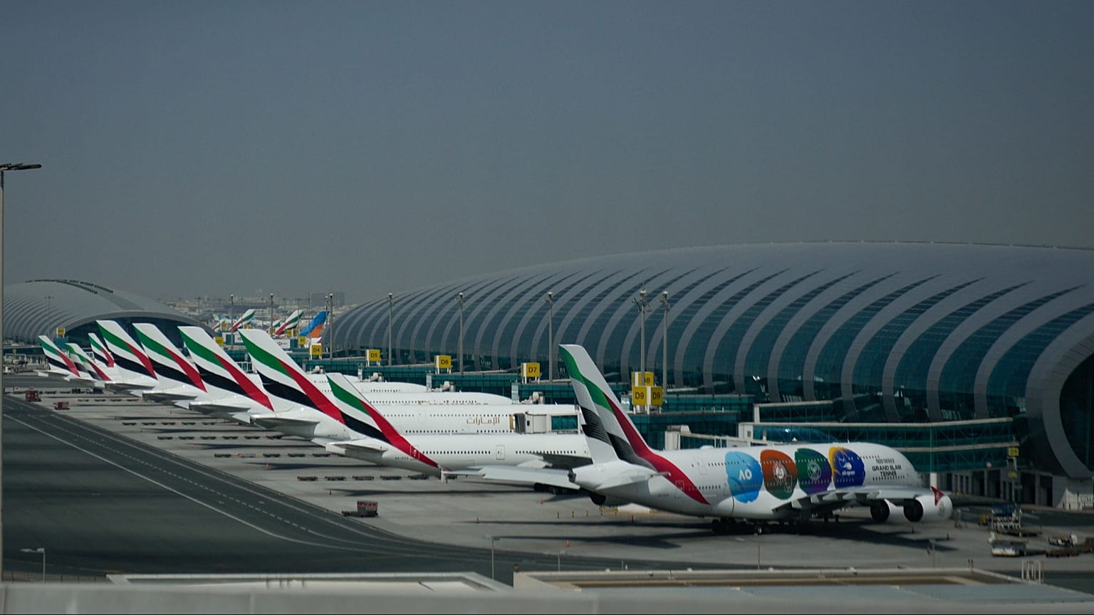 Emirates airplanes are parked at the Dubai International Airport after its closure 