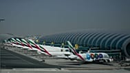 Emirates airplanes are parked at the Dubai International Airport after its closure 