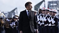 French President Emmanuel Macron reviews the troops during his visit to the nuclear submarine navy base of Ile Longue in Crozon, France