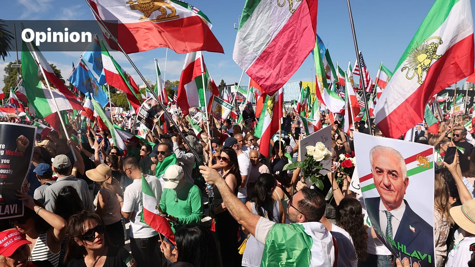 People chant with a portrait of exiled Iranian prince Reza Pahlavi during a rally supporting U.S. and Israeli strikes on Iran, Los Angeles, March 1, 2026