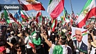 People chant with a portrait of exiled Iranian prince Reza Pahlavi during a rally supporting U.S. and Israeli strikes on Iran, Los Angeles, March 1, 2026