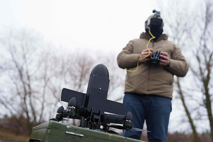 A serviceman prepares an interceptor drone of "General Cherry" company before a flight at the polygon in Ukraine, on Dec. 4, 2025