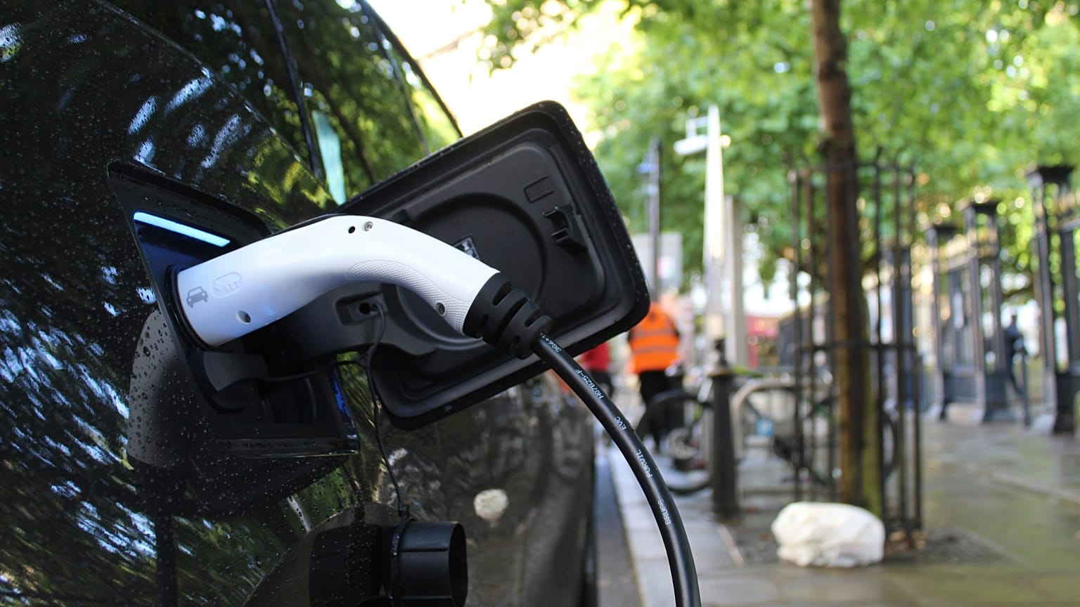 Close-up shot of an EV car being charged.