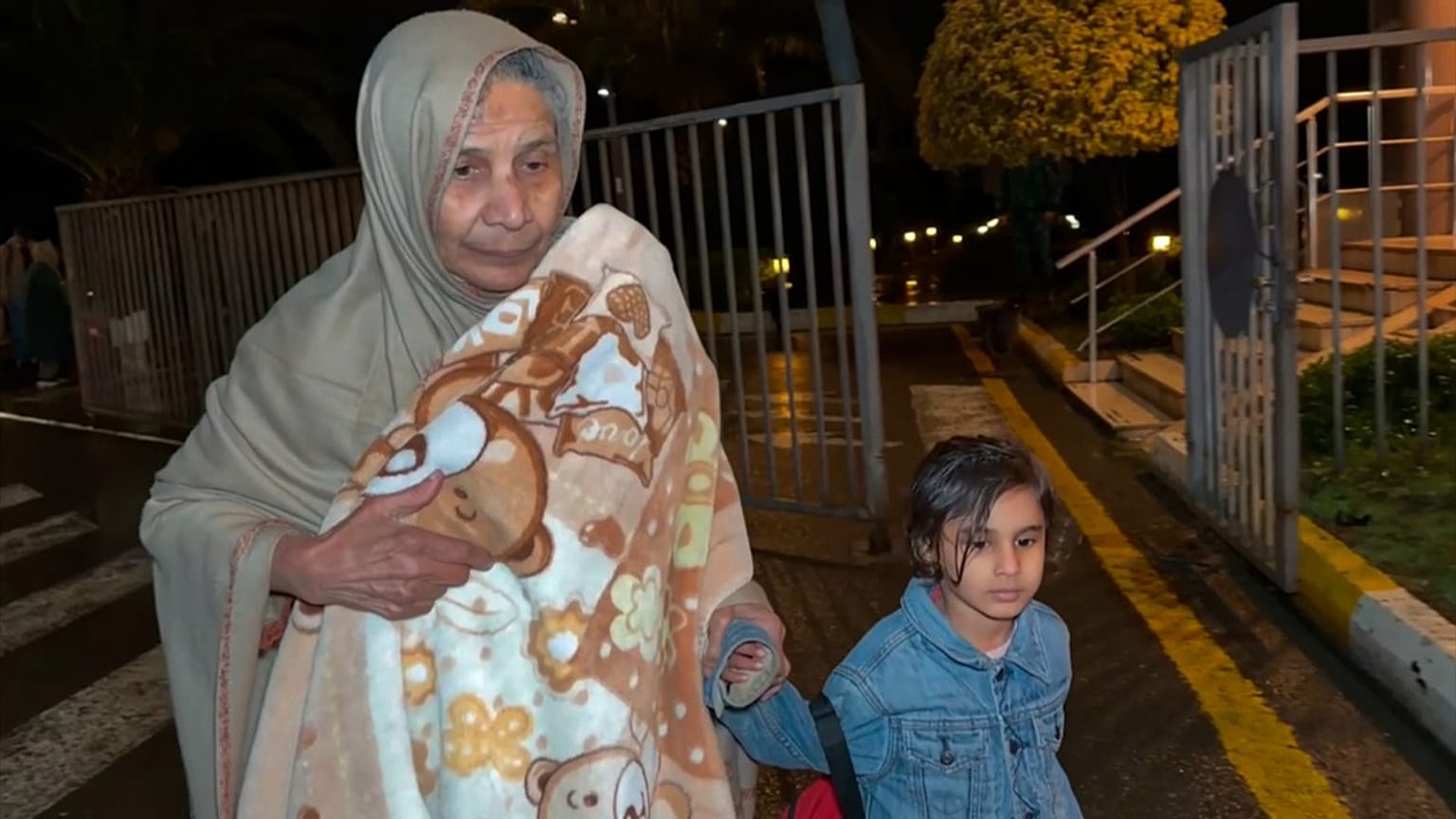 FILE: In this image taken from video, persons of various nationalities cross the Astara Checkpoint, in Azerbaijan, 2 March 2026