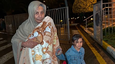 FILE: In this image taken from video, persons of various nationalities cross the Astara Checkpoint, in Azerbaijan, 2 March 2026