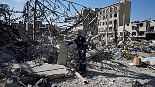 An electricity utility worker inspects the ruins of a police facility struck during the US–Israeli military campaign in Tehran, 4 March, 2026