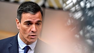 Spain's Prime Minister Pedro Sanchez speaks with the media as he arrives for an EU summit at the European Council building in Brussels, Thursday, March 23, 2023