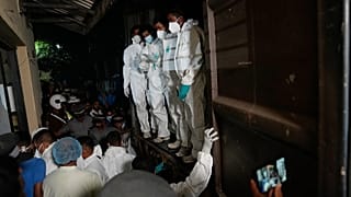 Healthcare workers unload the bodies of Iranian sailors from a vehicle who died when their IRIS Dena warship sank outside Sri Lanka's territorial waters, in Galle, Sri Lanka.
