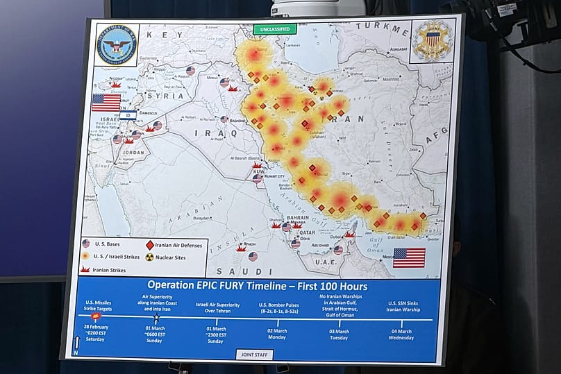A Dept. of Defense map entitled, Operation EPIC FURY Timeline - First 100 Hours, is displayed during a news conference at the Pentagon, Washington, March 4, 2026.